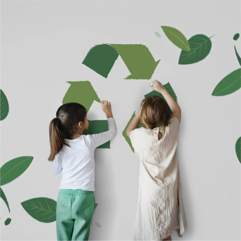 Recycling icon being painted on the wall by children
